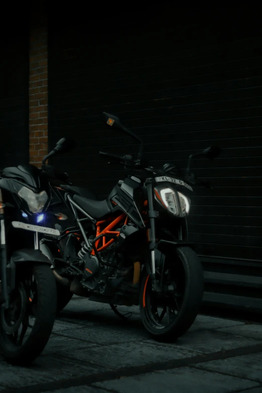 a motorcycle parked on a sidewalk in front of a garage