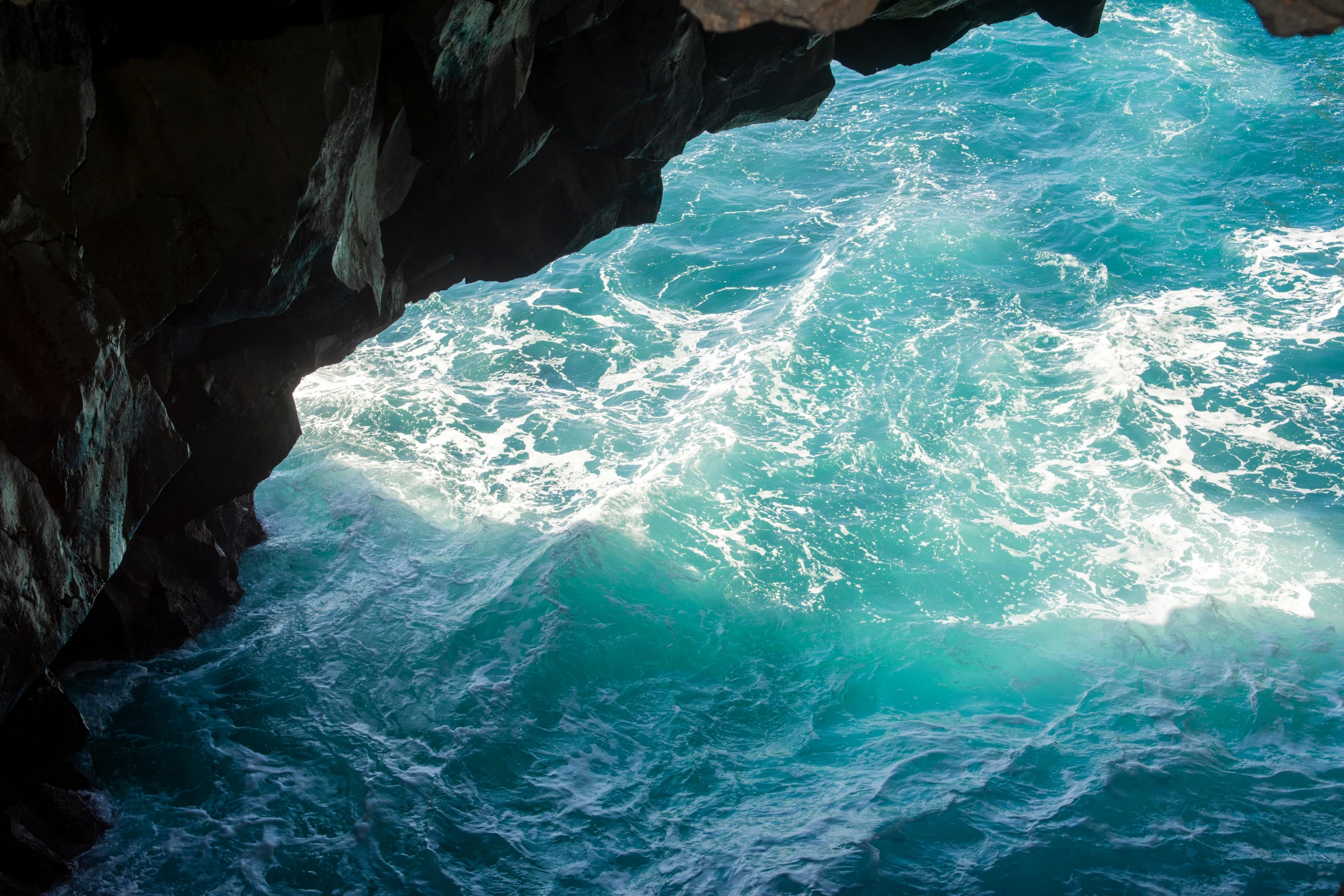 view of water from the top of cliff and the ocean below