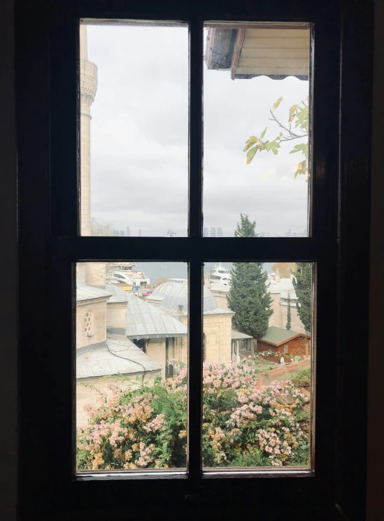 a window looks out onto the garden and town