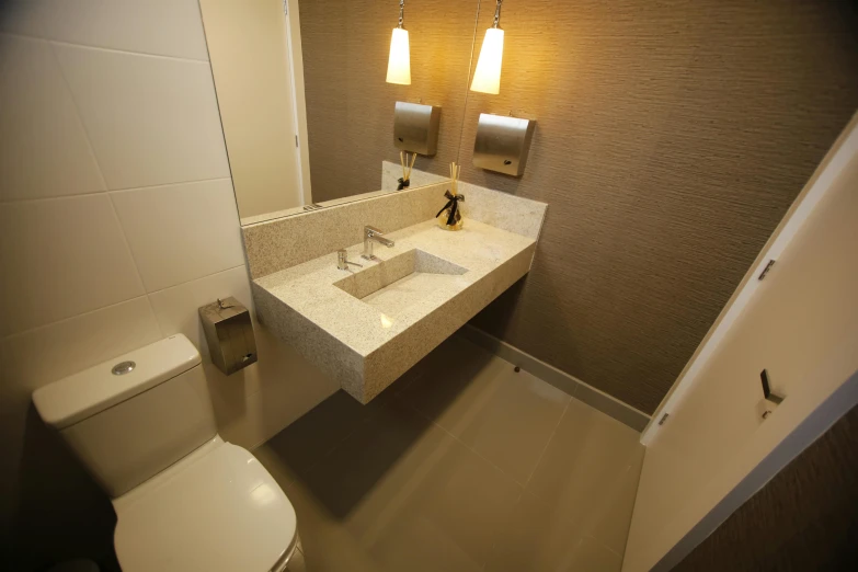 a bathroom with some towels hanging above a sink