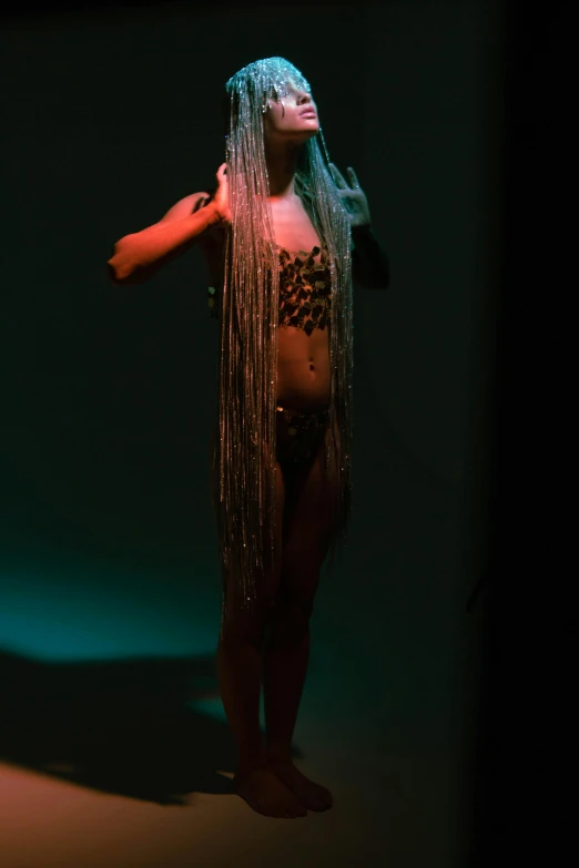 a woman wearing an animal print bikini in the dark