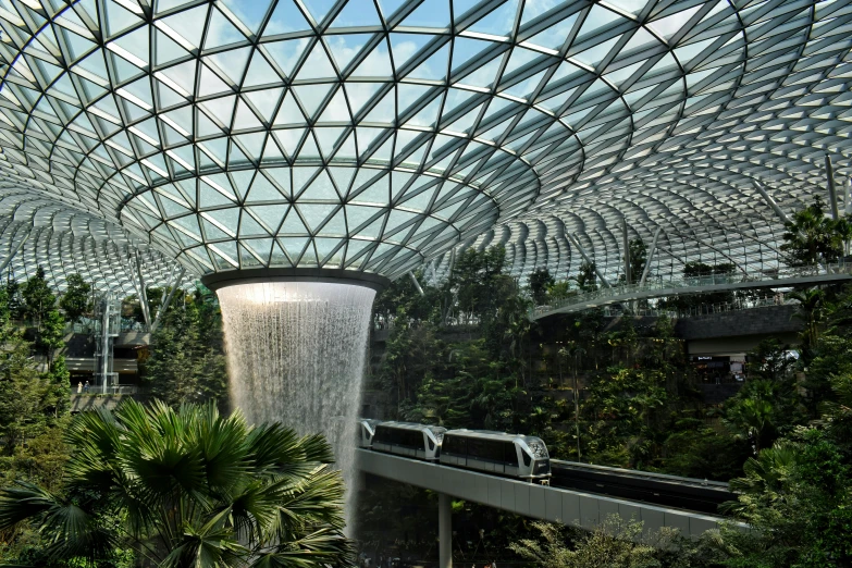 a train is passing inside the glass dome