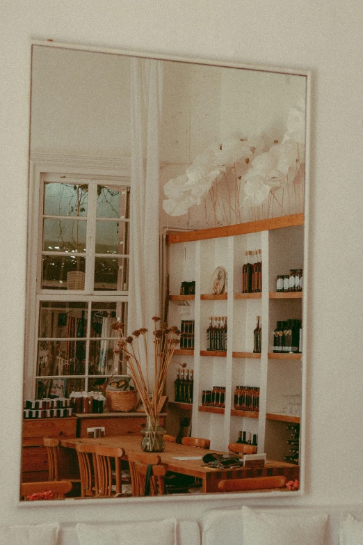 a shelf full of objects and books behind glass