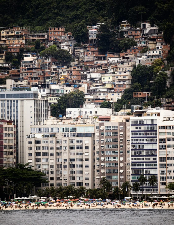 view of a city from a beach in the ocean