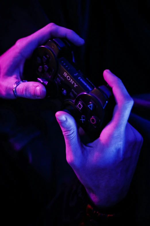 a person holding a video game controller in their hands