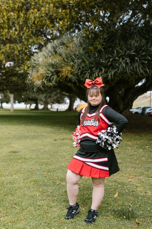 a woman is dressed in a cheerleader uniform