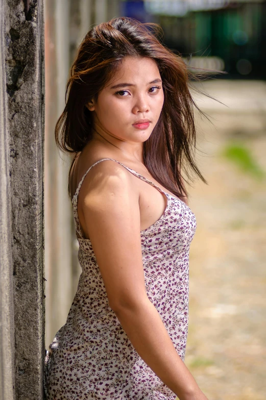 an asian young woman poses for a portrait