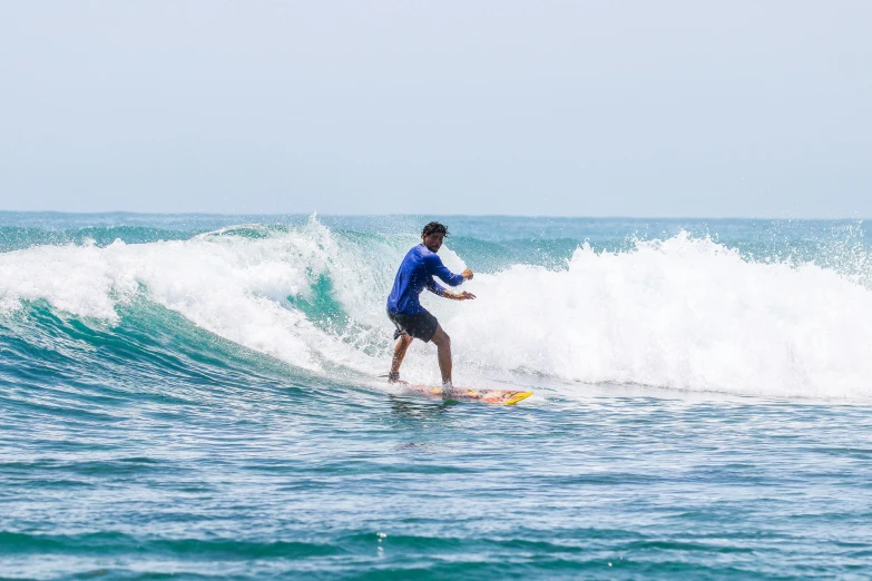 a surfer on the crest of a large wave