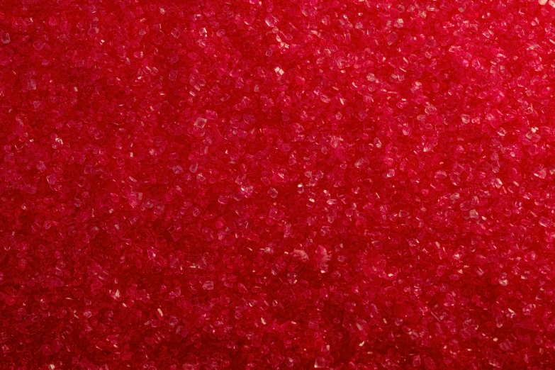 a red textured background of small circles