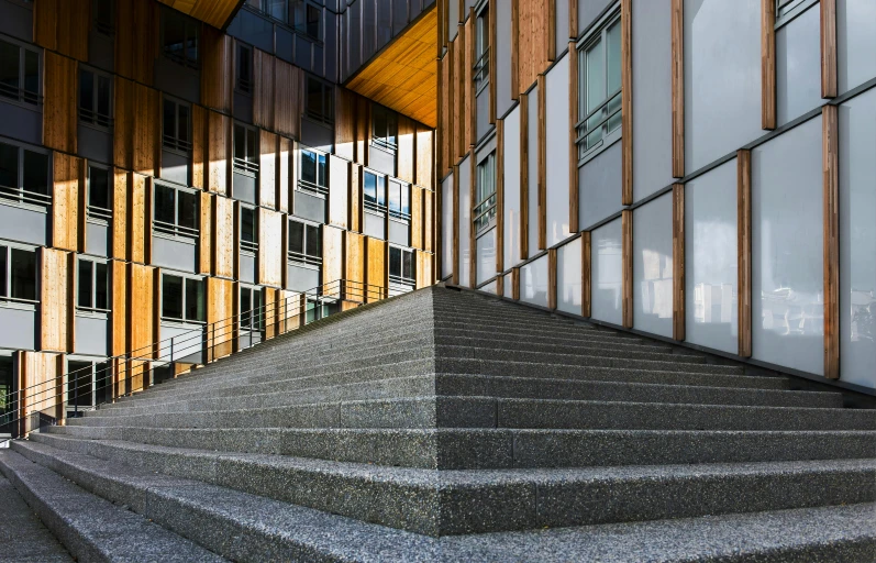 the steps outside of an office building are lined with windows