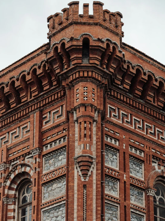 old brick building with a corner top