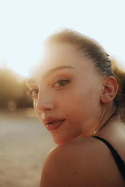 a woman that is wearing some kind of earrings