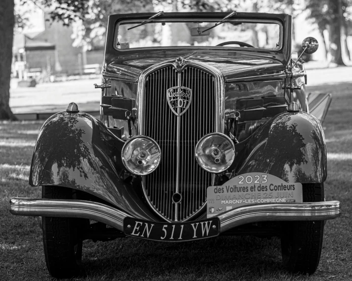 black and white po of an old fashioned car