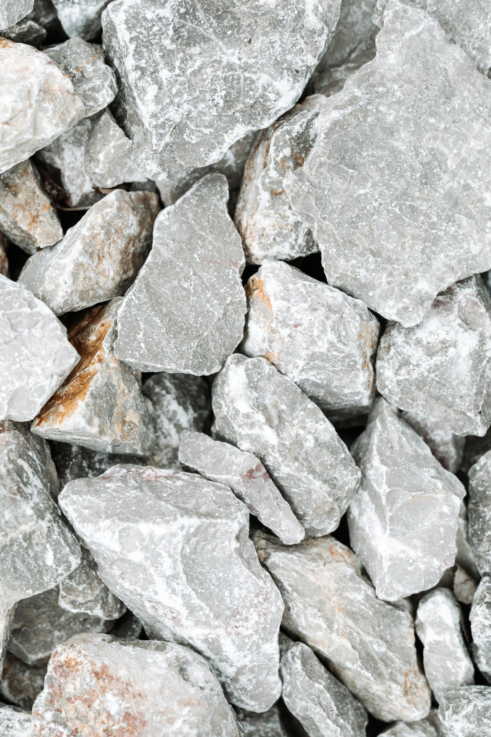 a bunch of grey rocks are in a pile