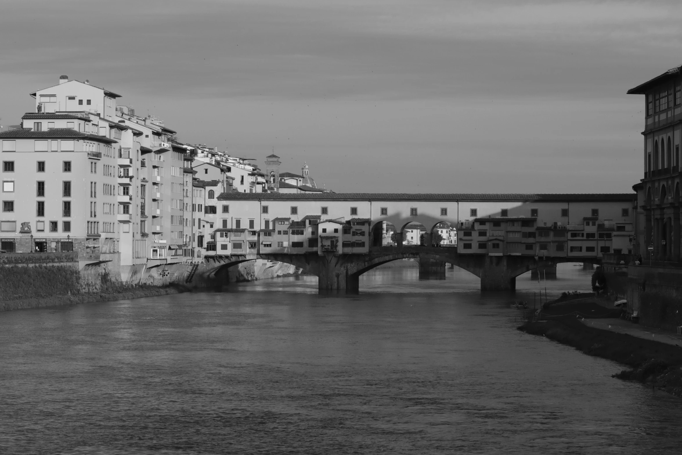 some water buildings buildings and bridge and people