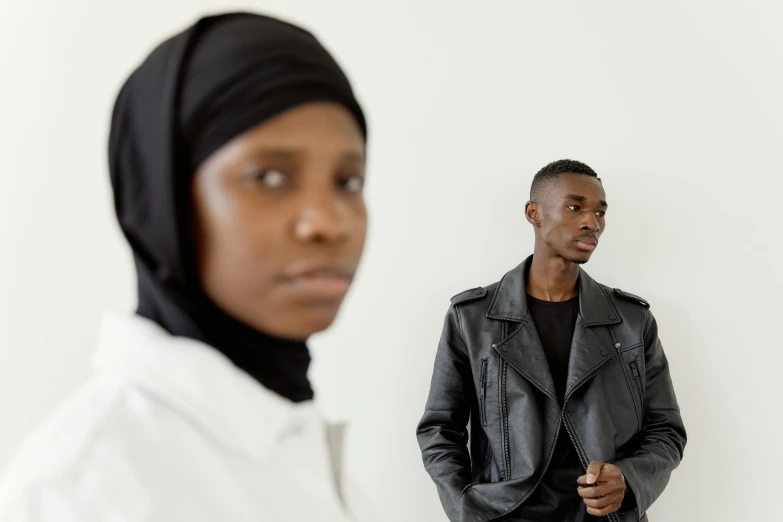 a black and white po of a man with a nun on his head