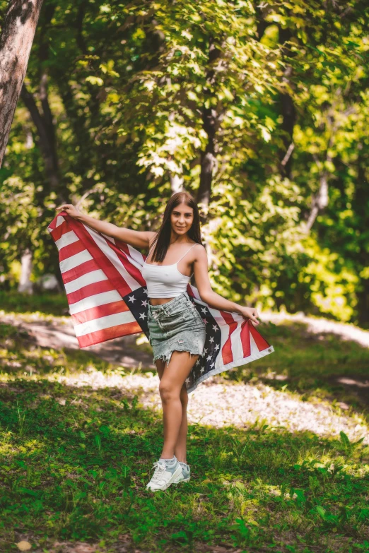 an american woman with a flag dd over her shoulder