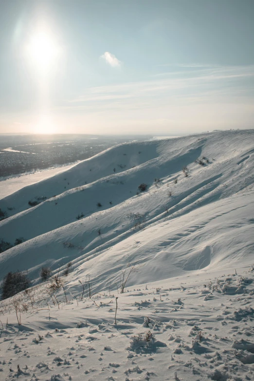 a skier skiing down the side of a snow covered slope