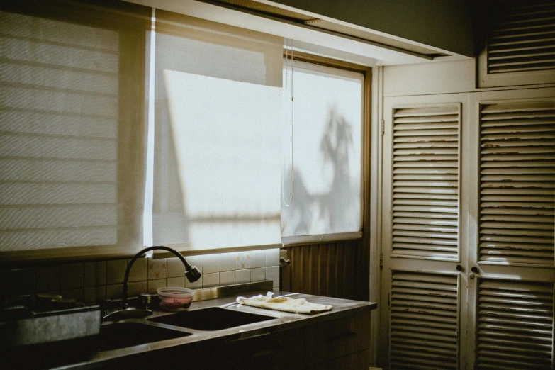 a small kitchen with a sink and window