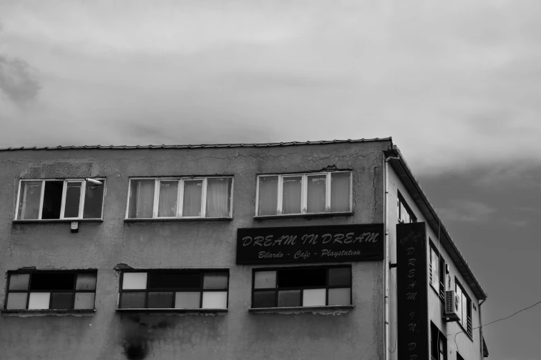 black and white image of an old building with windows