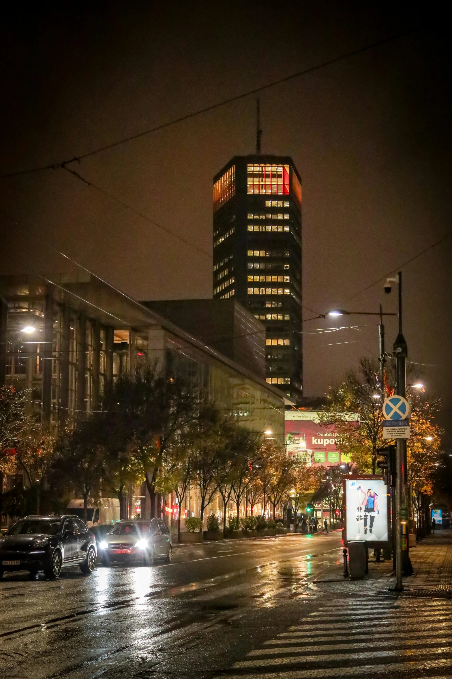 rain in the city at night is creating a dramatic scene