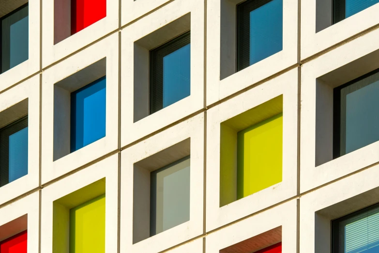 an image of a modern building with multiple panes of different colors