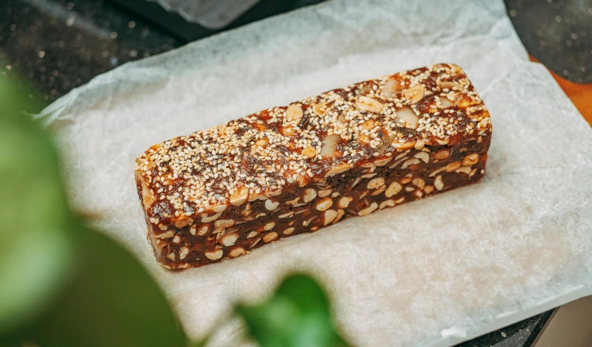 a sliced piece of food sitting on top of paper