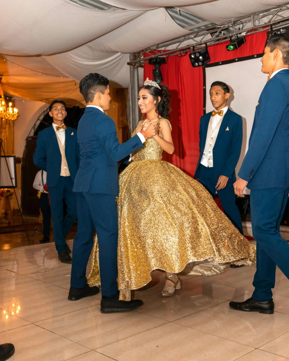 a bride and groom dance together in a tent