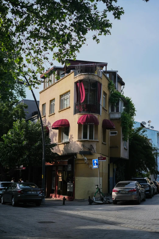 a house sits near the tree lined street