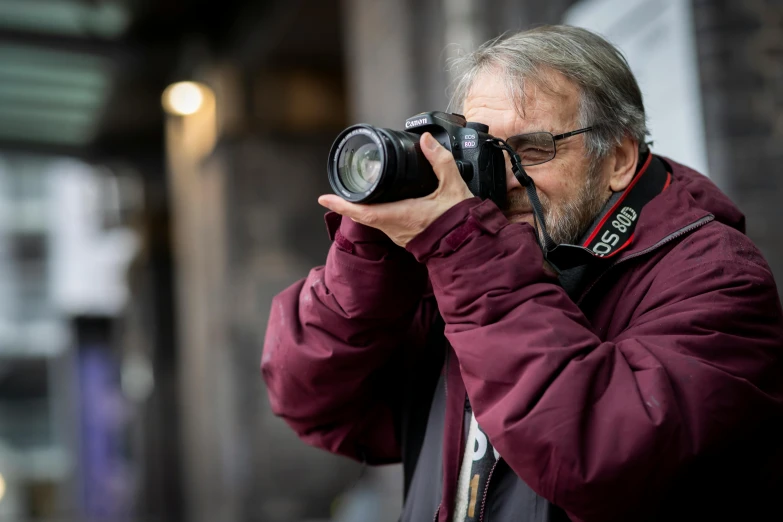 a man is taking a pograph with his camera