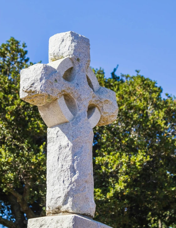 this is a cross made from rocks in the background