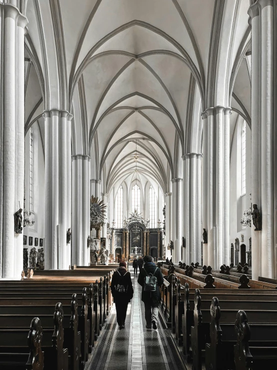 a black and white po of people at the altar