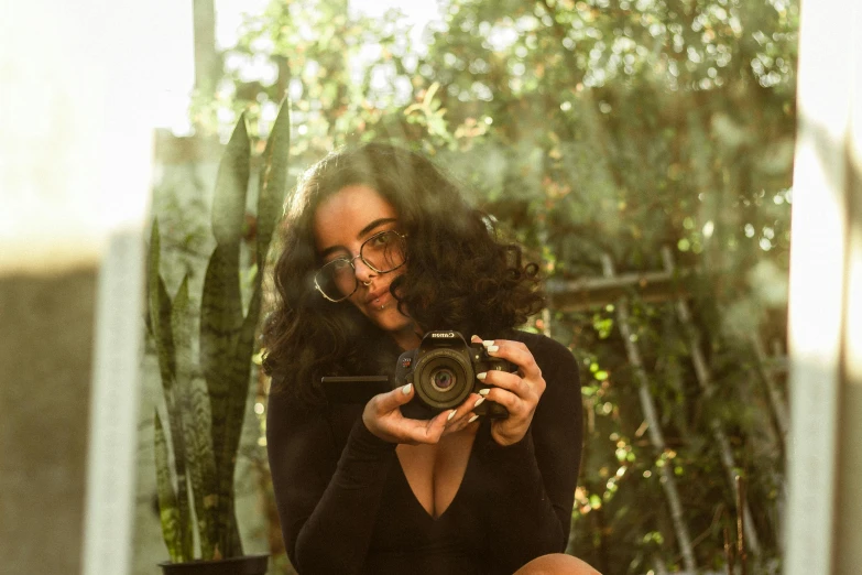 woman taking a selfie with her camera on the deck