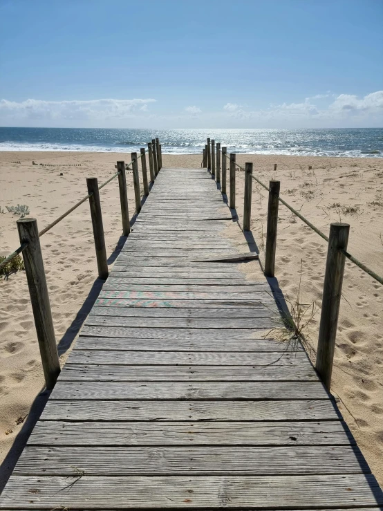 the boardwalk leading to the water is empty