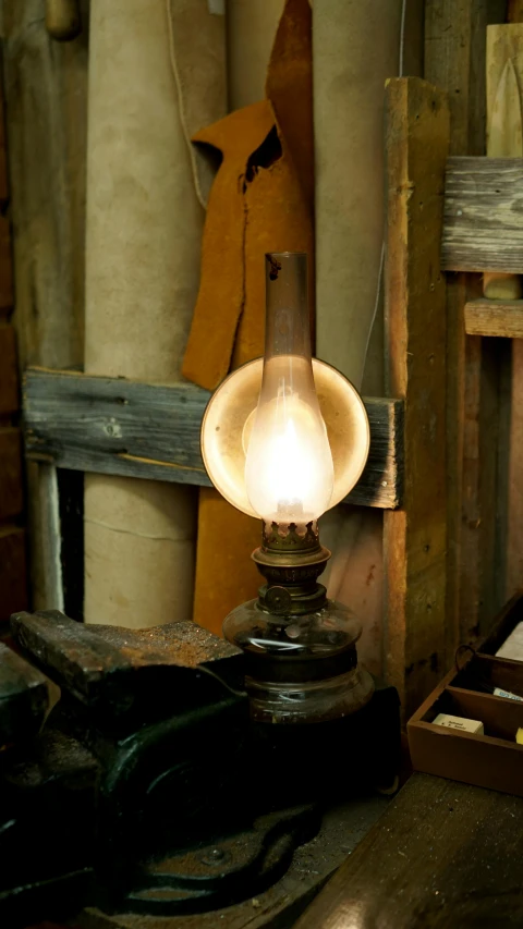 a light sitting on top of a wooden table