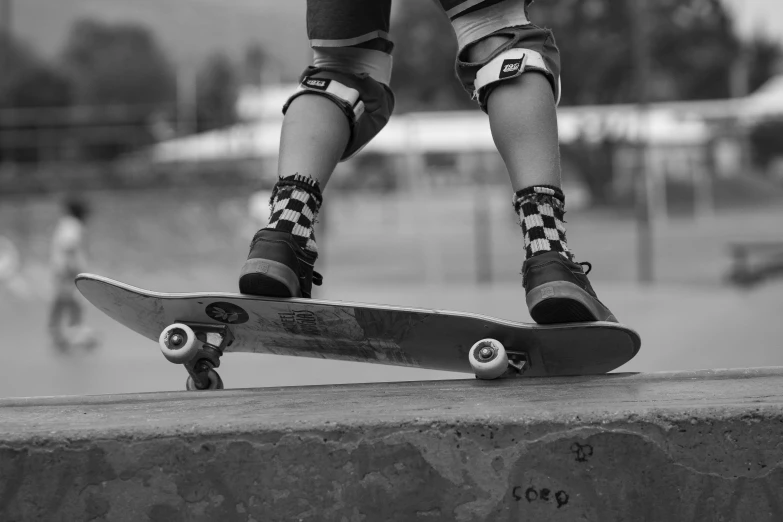 a skateboarder is doing a trick on the edge of the wall