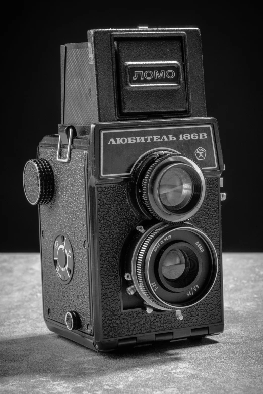 a camera sitting on top of a table next to a light