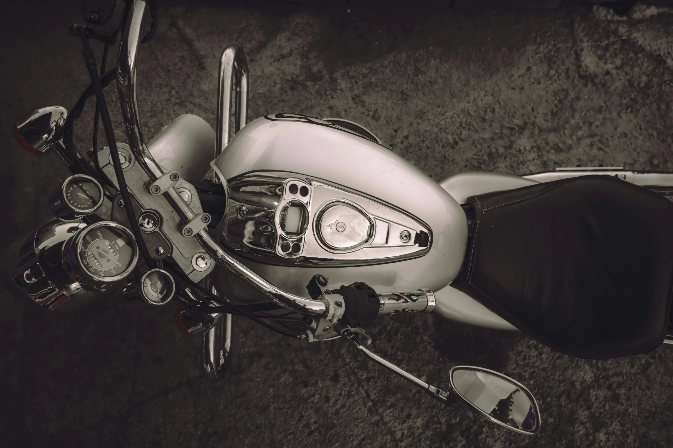 a woman in a dress is sitting on her white motorcycle