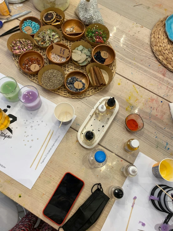 a close up of a wooden table with lots of dishes