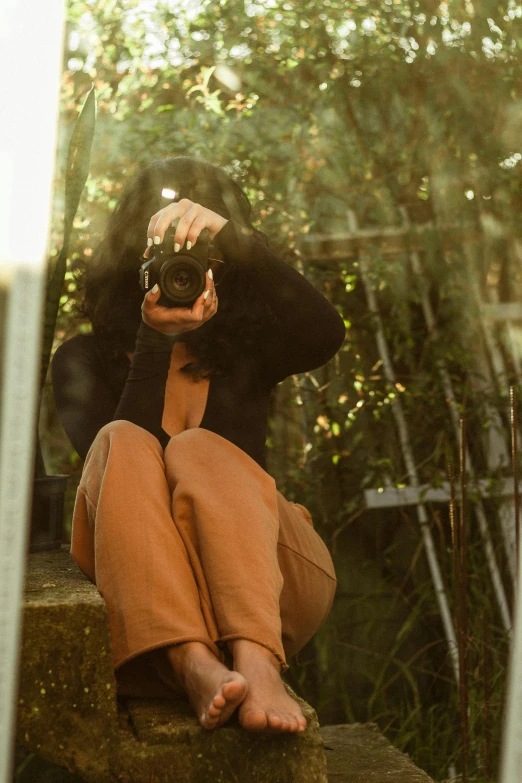 a person holding up a camera in front of their face