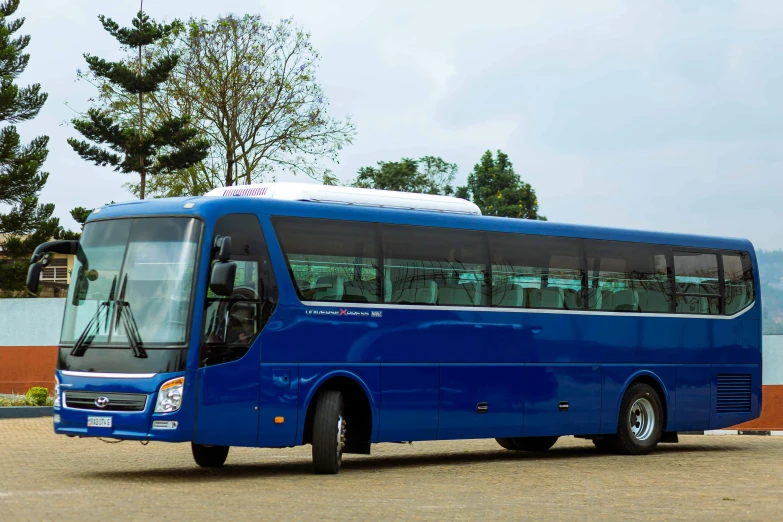blue bus sitting in lot of concrete area