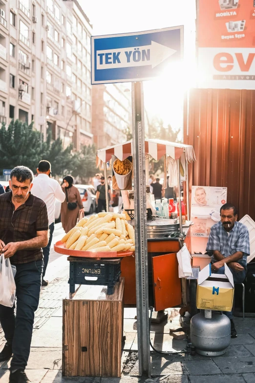 a street vendor on a city street with several people