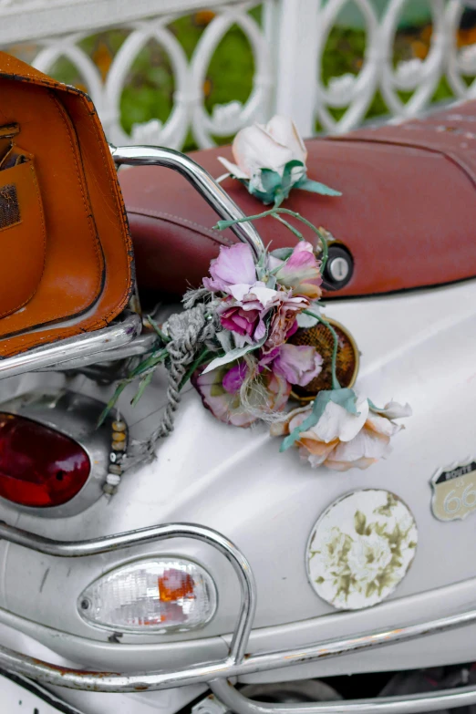 the white car has flower and other stickers on it