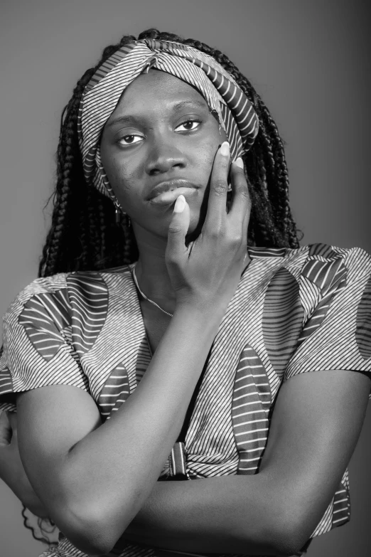 a young woman holds a cellular phone to her ear