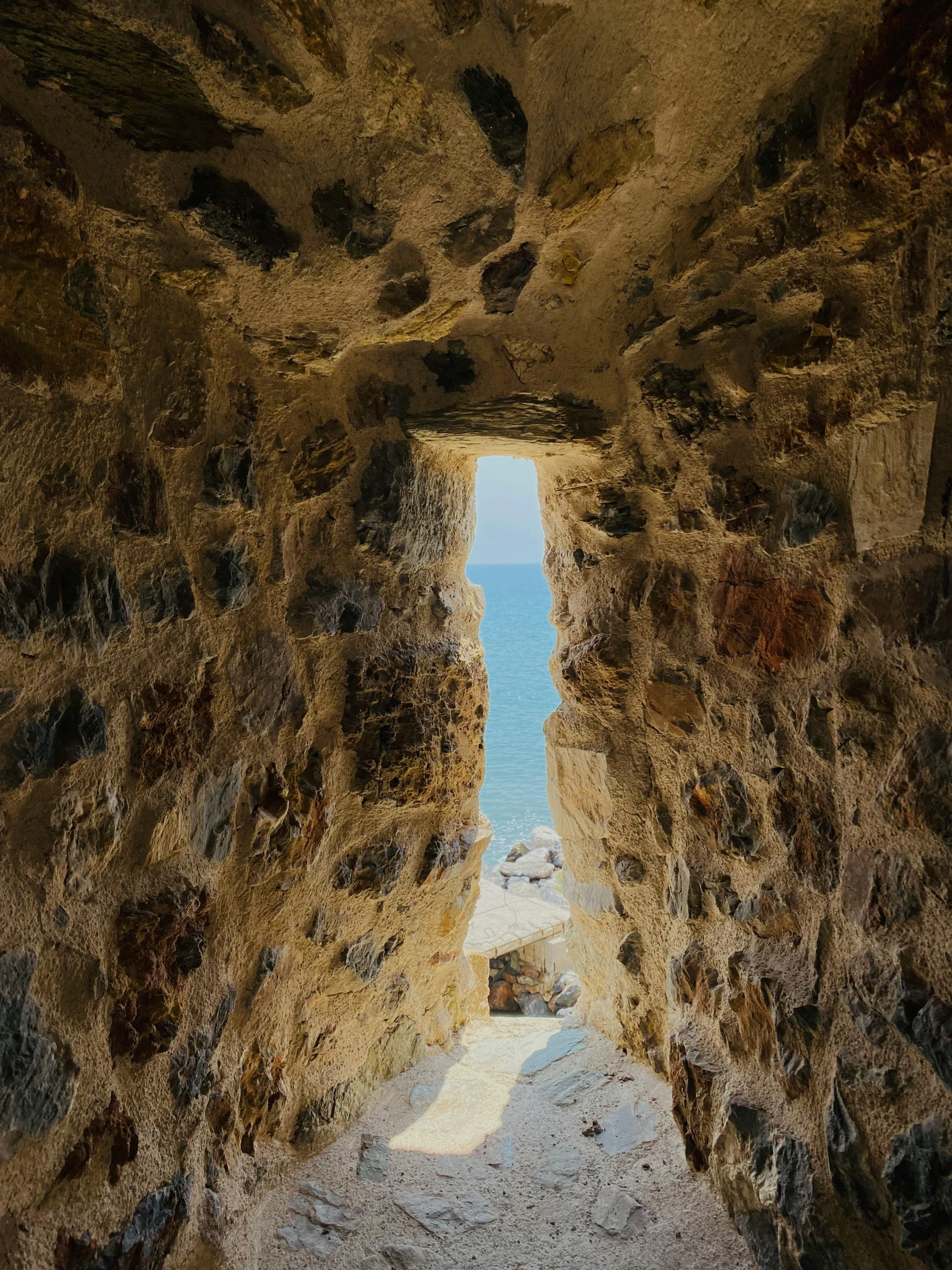 a narrow tunnel is made of rock and water