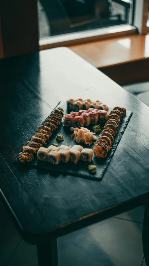 various food items are arranged on a black counter