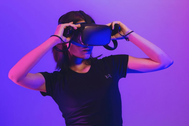 a woman using vr - glasses to take pos