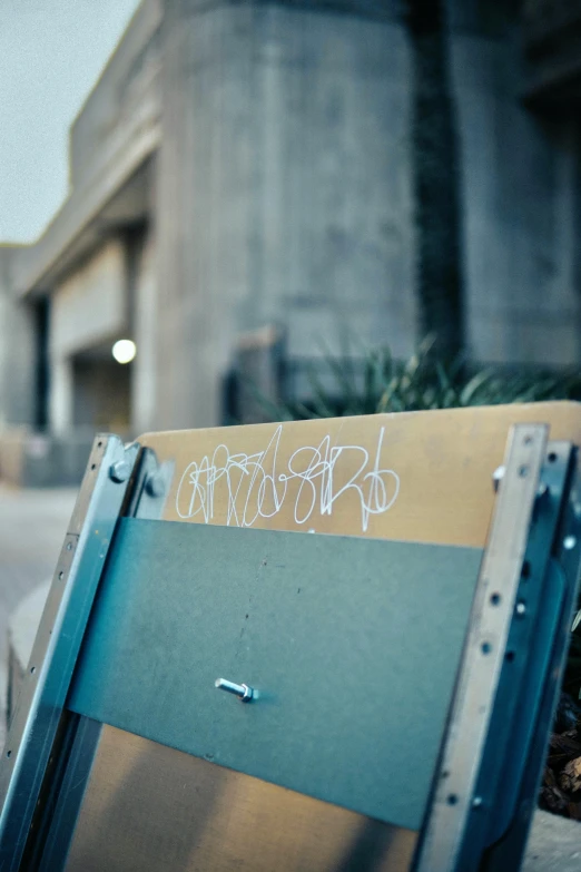 a closed box sitting on the street corner