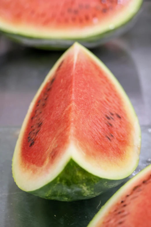 several pieces of a watermelon cut in half