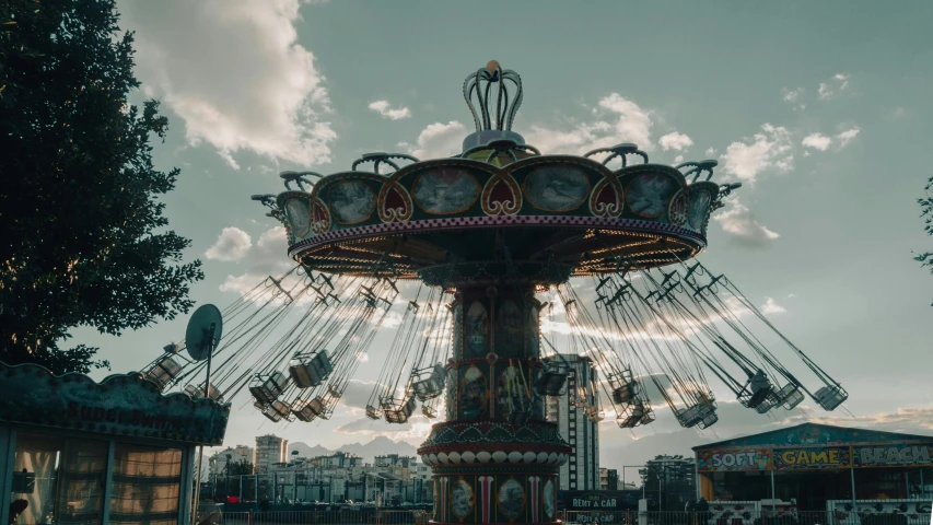 a carnival rides in the park on a bright day